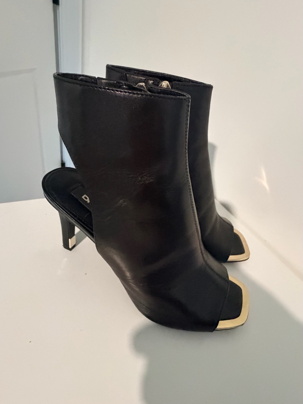 DKNY Black Leather Open-Toe Heel Boots with Gold Trim